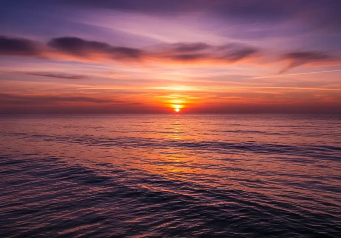 7 Reasons Why The Megalodon Was The Ultimate Apex Predator 23 A final wide banner image of the ocean horizon at sunset, symbolizing the mystery of what lies beneath.